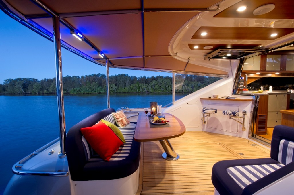 The Belize 52 Sedan features a breakfast bar with swivel stools to port and an aft dining area © Riviera . http://www.riviera.com.au